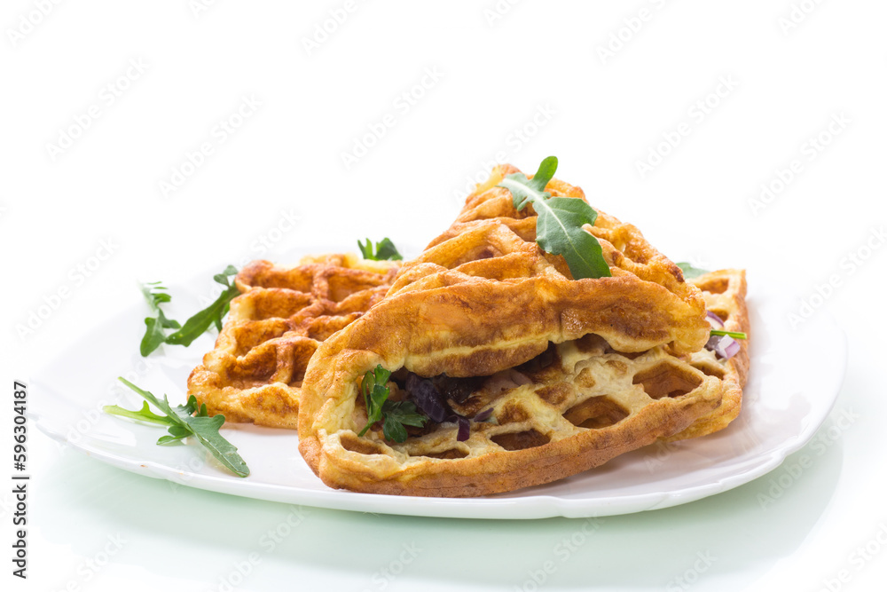 Egg omelette stuffed with onions and herbs, fried in the form of waffles