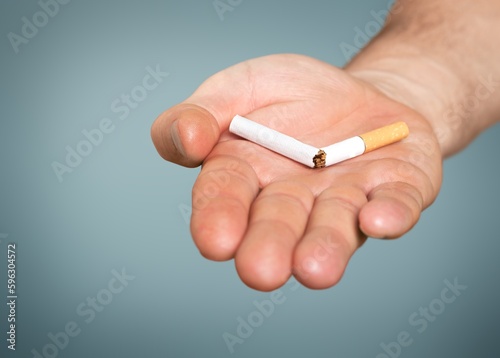 Stop smoking concept, Hand with broken cigarette