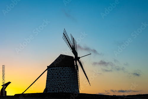 The sun setting behind the Windmill at Villa Verde La Oliva Fuerteventura