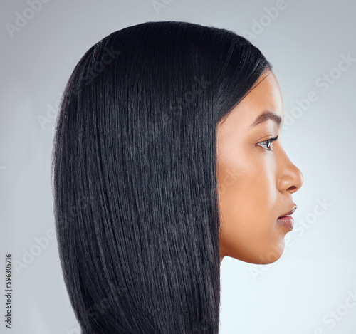 Sleek on fleek. Studio shot of an attractive young woman posing against a grey background. photo