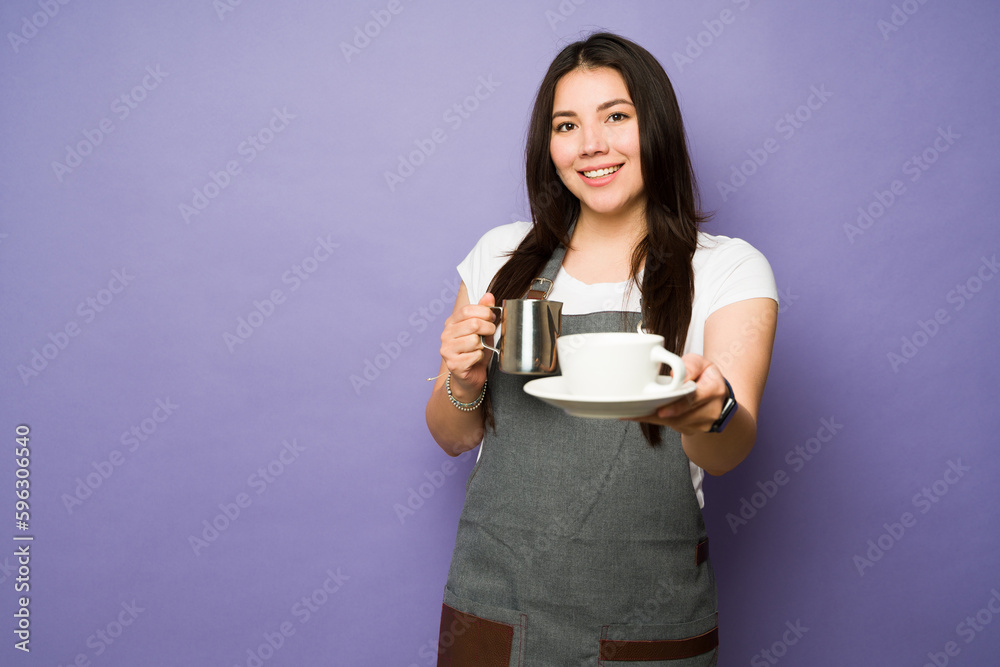 Female barista working at the coffee shop Female barista working at the coffee shop