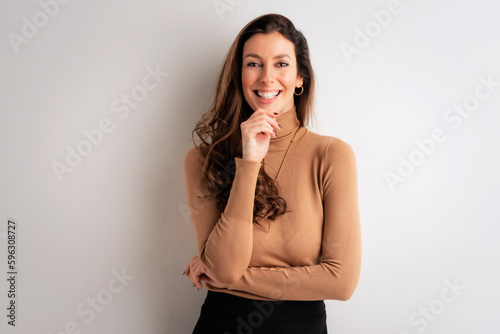 Portrait of an attractive with toothy smile standing at isolated background