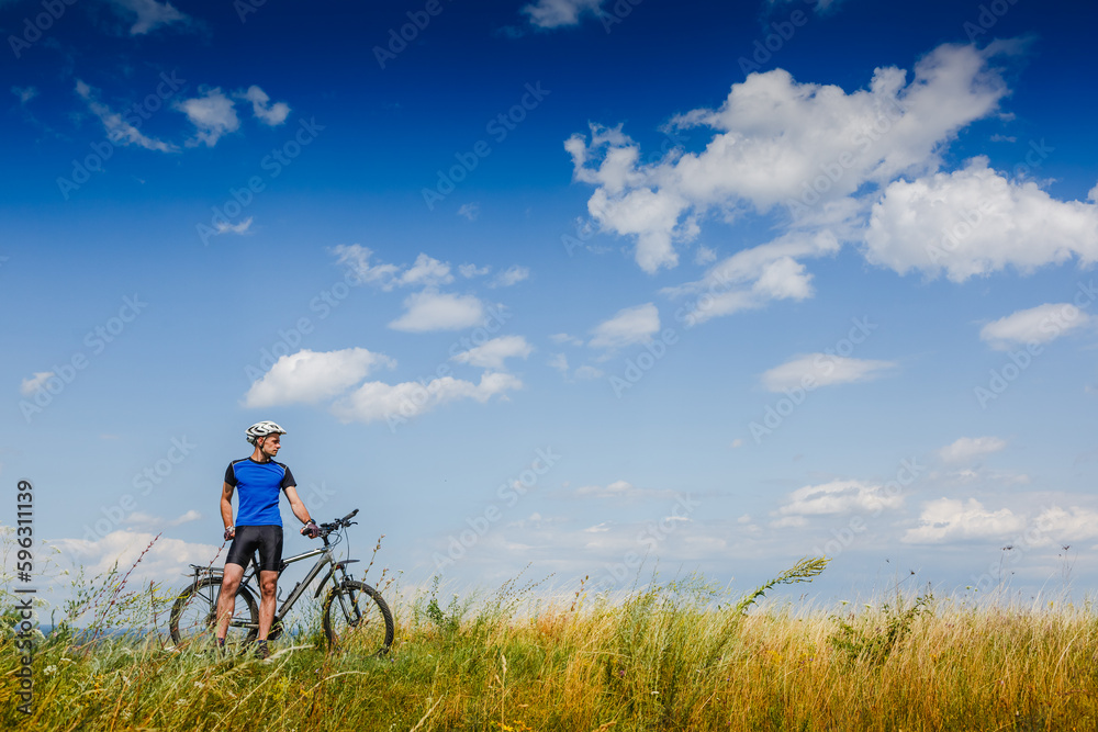 Mountain Bike cyclist on a sunny day. Healthy Lifestyle and Travel Concept