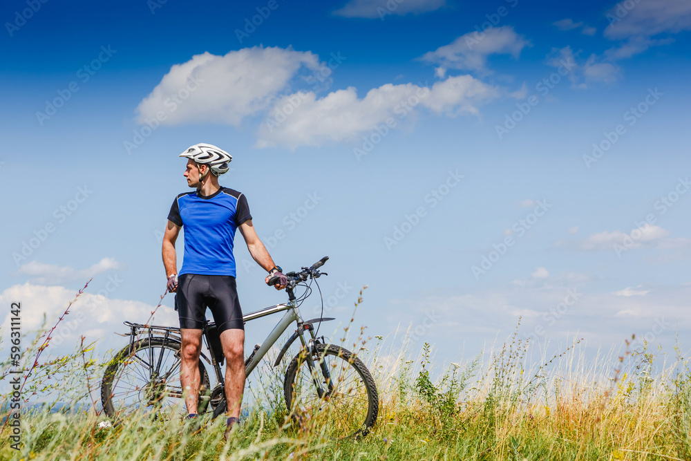 Mountain Bike cyclist on a sunny day. Healthy Lifestyle and Travel Concept Mountain Bike cyclist on a sunny day. Healthy Lifestyle and Travel Concept