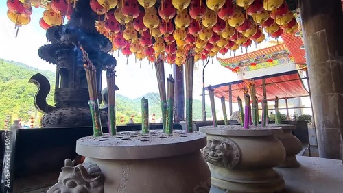 Traditional burning Incense sticks outside Buddhist temple