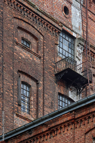 Obraz na płótnie Abandoned neglected red brick buildings of the great textile industry in Lodz w salonie