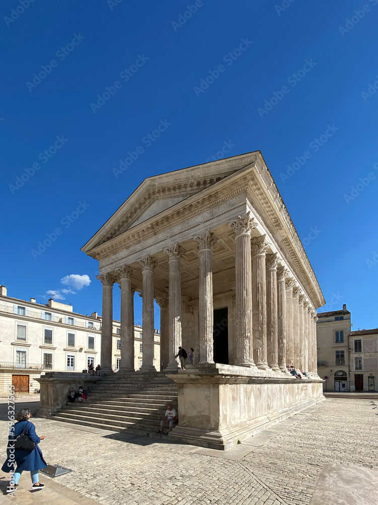 Nîmes, France - 04 19 2023: Square House. View of the monument and statue.