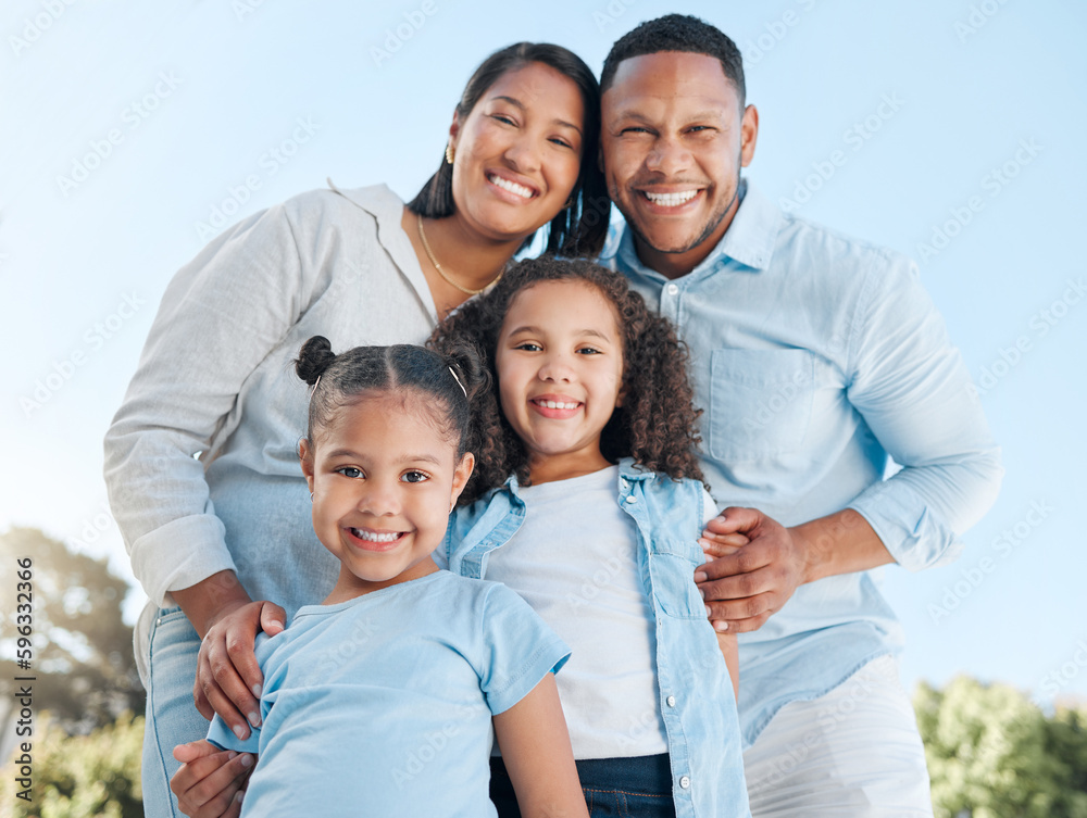 Nothing is more important than spending time with your family. Shot of a couple standing outside with their two daughters. Nothing is more important than spending time with your family. Shot of a couple standing outside with their two daughters.