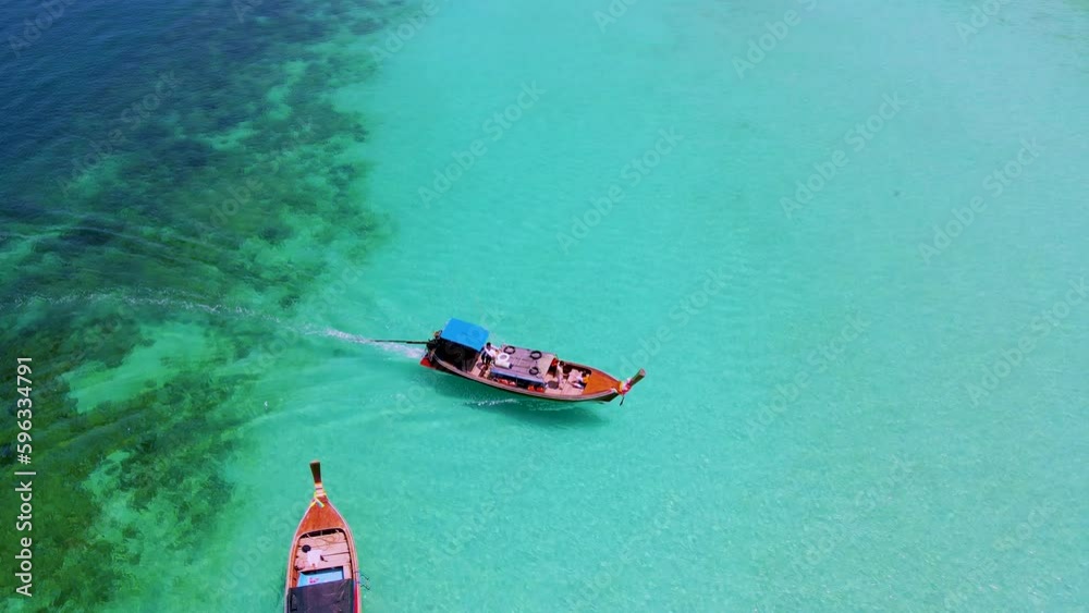 Koh Kradan Island Southern Thailand with longtail boats at the beach