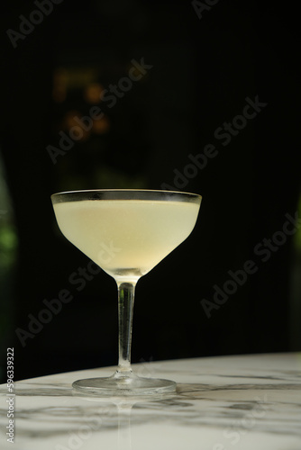 Margarita cocktail glass with martini and dry lemon slice