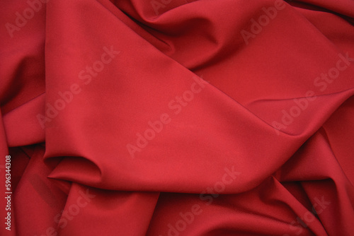 Beautiful red satin background close-up in the photo studio
