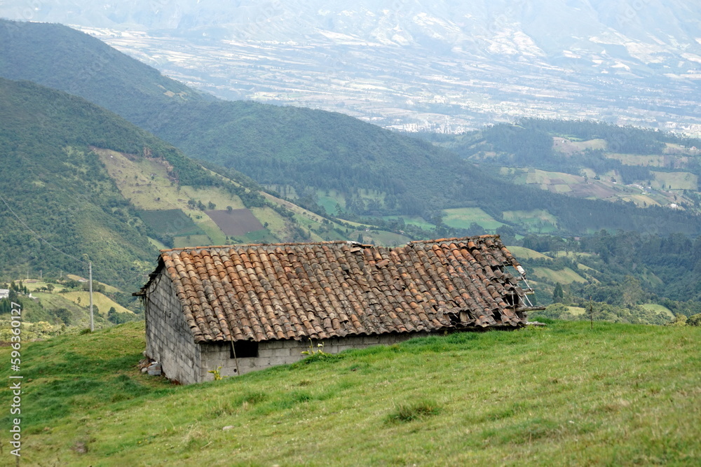 Old farm buidling with a collapsing roof on the road to Lago Mojanda, above Otavalo, Ecuador