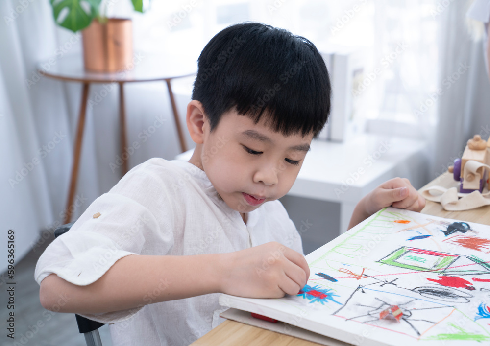 Chinese boy painting at school Chinese boy painting at school