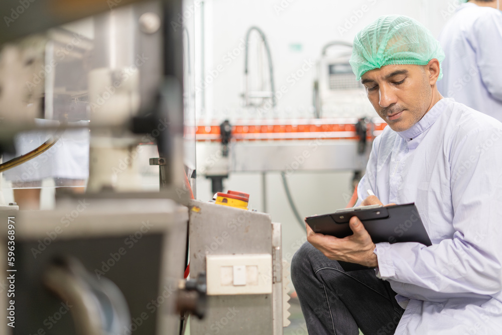 quality supervisor or food or beverages technician inspection about condition control food or beverages before send product to the customer. Production leader recheck machine and productivit