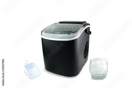 black modern design ice maker is used for making clean ice for various kinds of soft drink during summer on the white table with white scoop and a glass of ice isolated on white background photo