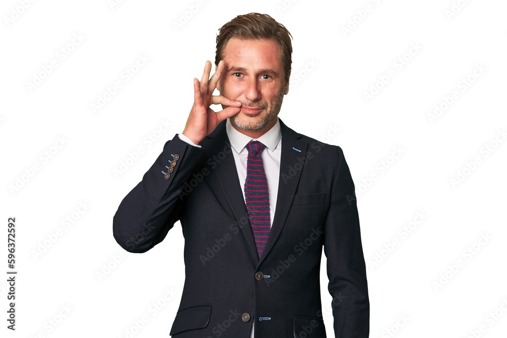 A middle-aged businessman isolated with fingers on lips keeping a secret. A middle-aged businessman isolated with fingers on lips keeping a secret.