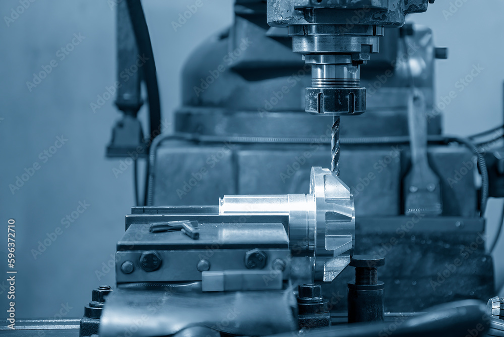 The drilling process on NC milling machine with automotive parts. The drilling process on NC milling machine with automotive parts.