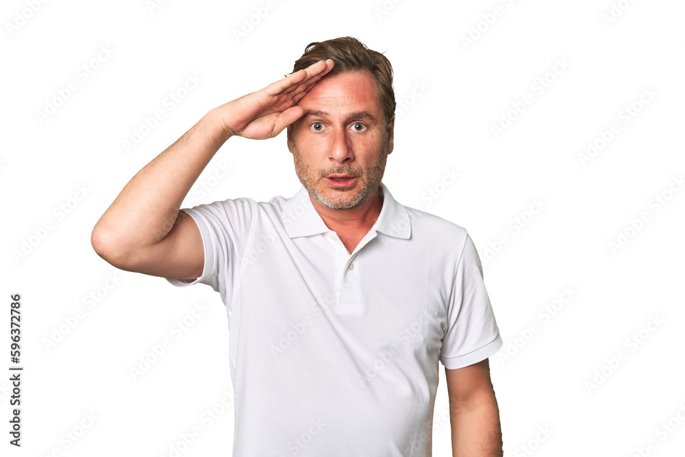 A middle-aged man isolated shouts loud, keeps eyes opened and hands tense. A middle-aged man isolated shouts loud, keeps eyes opened and hands tense.