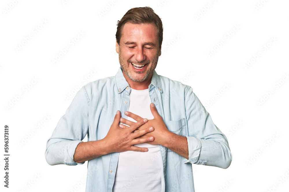 A middle-aged man isolated laughs happily and has fun keeping hands on stomach. A middle-aged man isolated laughs happily and has fun keeping hands on stomach.