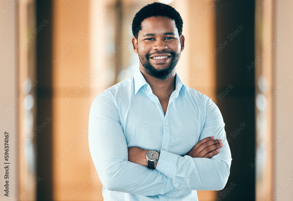 Weve got work to do. Shot of a young businessman standing with his arms crossed at work. Weve got work to do. Shot of a young businessman standing with his arms crossed at work.