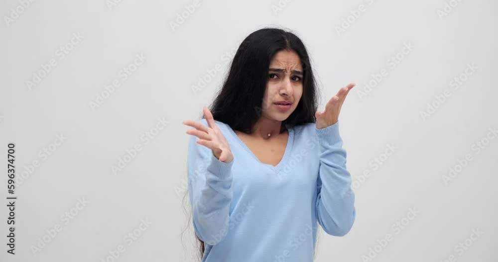 Terrified woman showing stop gesture with palm of her hand Terrified woman showing stop gesture with palm of her hand