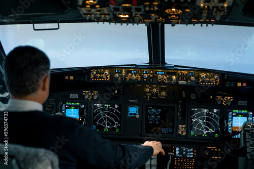 The pilot in the cockpit of the aircraft turbulence during the flight Flight simulator navigation devices