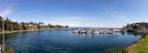 Sailboats in marina on the ocean shore. Nanoose Bay, Vancouver Island, British Columbia, Canada. Panorama