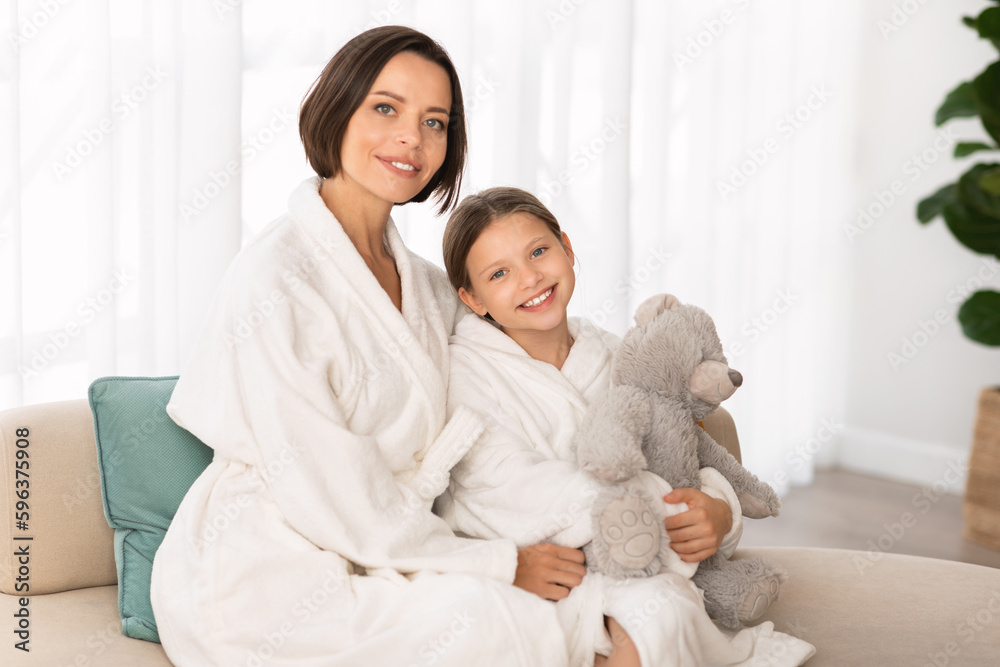 Mom And Child. Portrait Of Happy Mother And Little Daughter Wearing Bathrobes Mom And Child. Portrait Of Happy Mother And Little Daughter Wearing Bathrobes