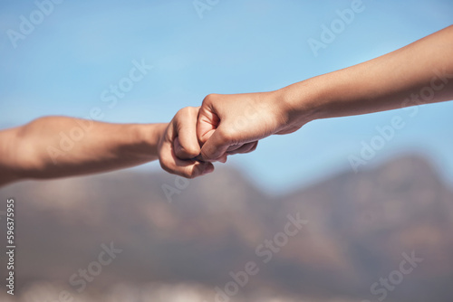 Motivate your partners to do their best. Shot of two workout partners fist bumping one another.
