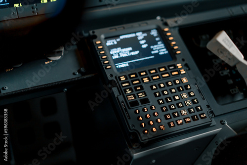 A detailed shot of the control and navigation panel in the cockpit of a Boeing 737 Flight Simulator passenger plane © Guys Who Shoot