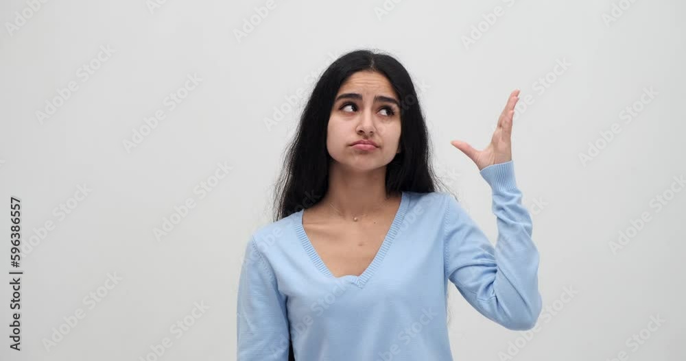 Young woman making blah blah gesture with hand Young woman making blah blah gesture with hand