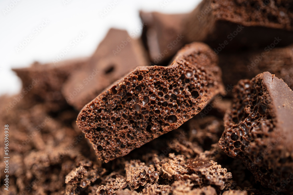 Close-up of a pile of grated porous chocolate for confectionery Close-up of a pile of grated porous chocolate for confectionery