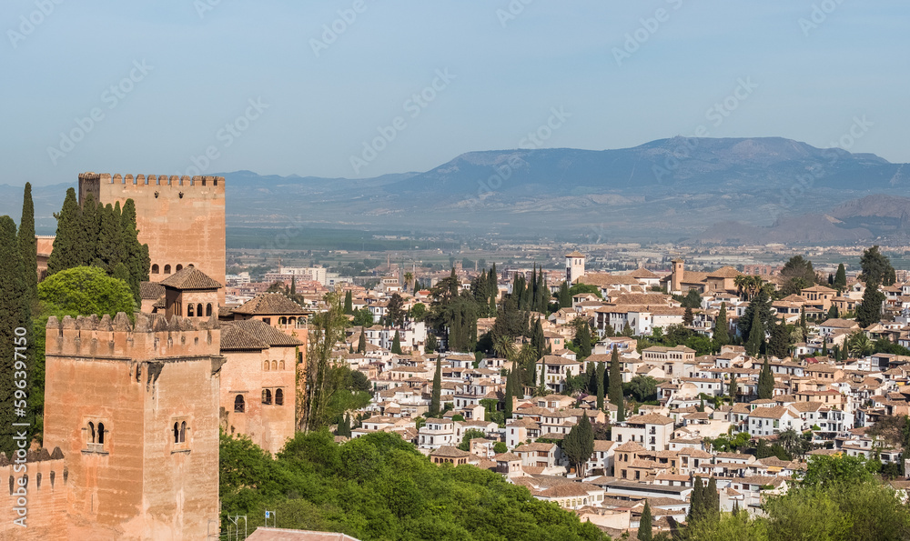 Albacin old town roofs top view from the Generalife gardens, Alhambra castle, Andalusia, Spain. Wide angle panoramic high-resolution photo.