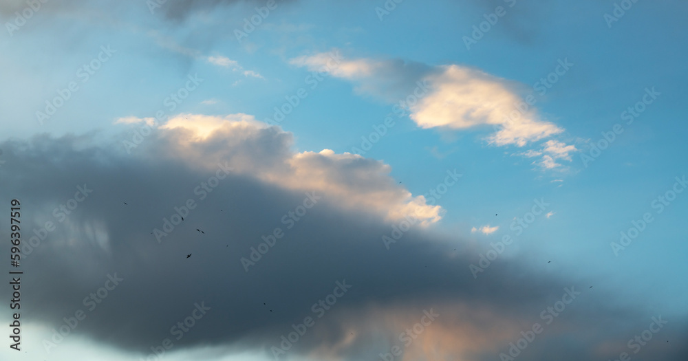 Beautiful bright orange sunset sky with clouds. Sunset sky with clouds background. Beautiful bright orange sunset sky with clouds. Sunset sky with clouds background.