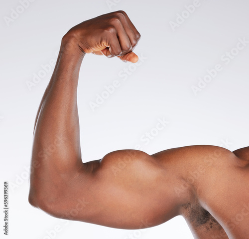 Always stay focused on the results. Cropped shot of an unrecognisable man flexing his bicep while posing in the studio.