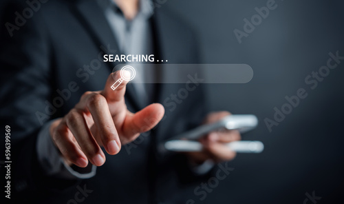 Search engine Optimization or SEO concept. Businessman using smartphone searching data, Internet connection online for find information, Using Search Console with website.