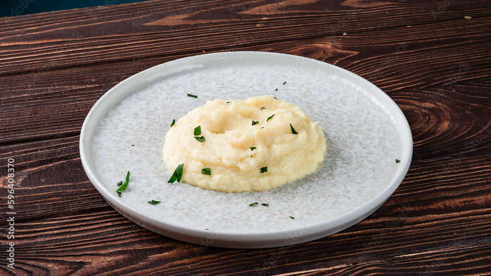 Mashed potatoes with greens in a plate. Mashed potatoes with greens in a plate.