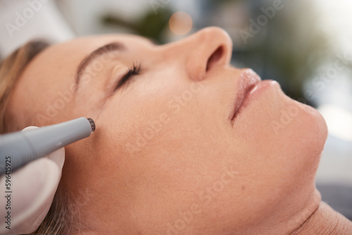 Giving the skin a stronger, more youthful appearance. Closeup shot of a mature woman enjoying a micro-needling treatment at a spa.