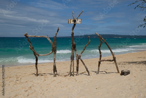 beach name made fron tree branches, Puka beach, Boracay, Philippines