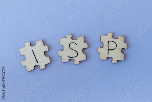 The acronym ISP, which stands for Internet Service Provider. The letters written on the puzzles.
