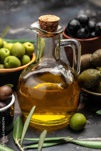 extra virgin olive oil in glass bottles on a wooden background. Healthy and detox food concept. place for text