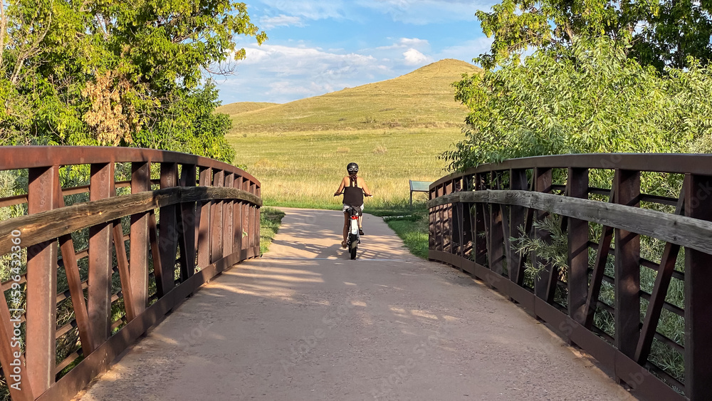 woman riding bike in Colorado foothills