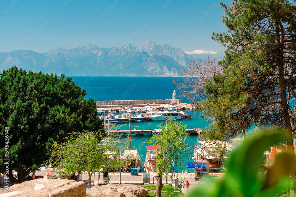 Fototapeta premium Aerial view of the port and the lighthouse in the Turkish city of Antalya. View of the port from Kaleici in Antalya.