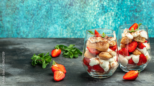 Strawberry tiramisu with mascarpone. Summer dessert, classic tiramisu with strawberries decorated with mint leaves, catering, banner, menu, recipe, place for text