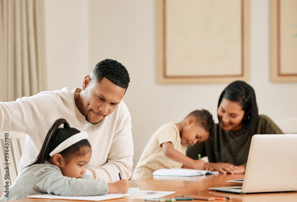 Its what we signed up for as parents. Shot of a young family doing homework together at home.