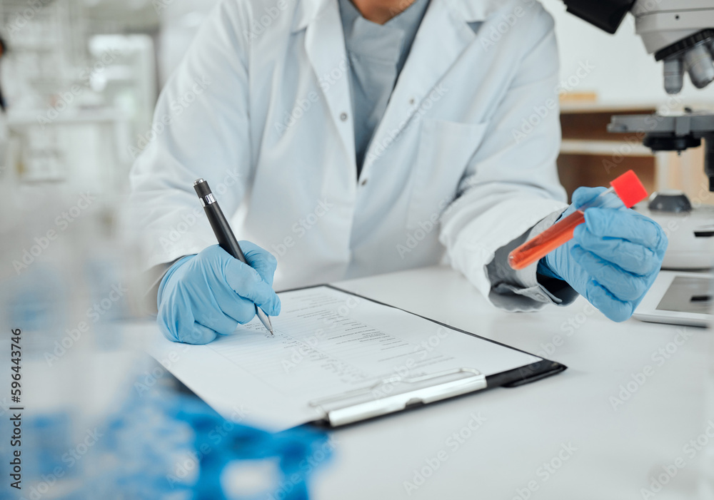 Keeping record of experiments matters. Shot of a scientist holding a sample while making notes. Keeping record of experiments matters. Shot of a scientist holding a sample while making notes.