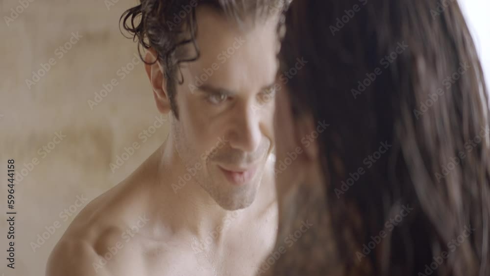 Passionate young man and woman having sex in bathroom with wet hair