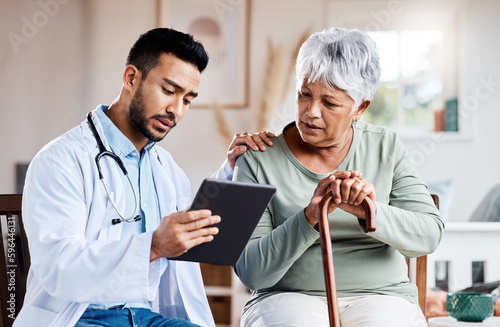 Well have to run more tests. Shot of a young doctor sharing information from his digital tablet with an older patient. photo