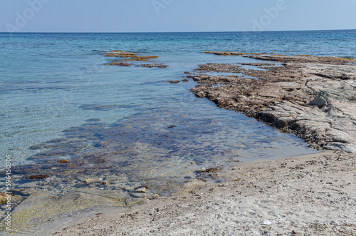 Fototapeta Naklejka Na Ścianę i Meble -  reefs and crystal clear water of Aegean Sea on Alacati coast near Gilikli beach (Cesme, Izmir province, Turkey) 