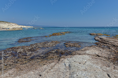 Fototapeta Naklejka Na Ścianę i Meble -  reefs and crystal clear water of Aegean Sea on Alacati coast near Gilikli beach (Cesme, Izmir province, Turkey) 